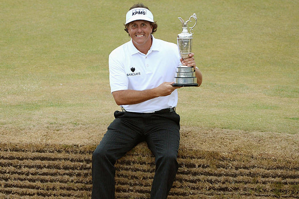 Phil Mickelson poses with the Claret Jug after winning The Open at Muirfield in 2013